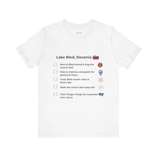 White t-shirt with a checklist of activities related to Lake Bled, Slovenia on a white background.