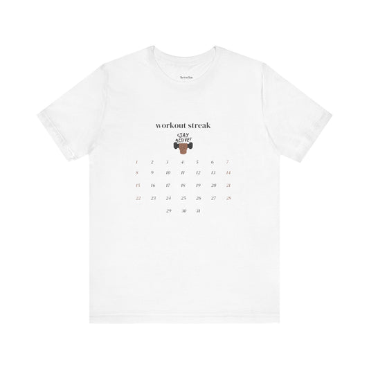White t-shirt with a workout calendar design and text on a white background